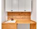 Well-designed laundry room with extra counter space, cabinets for storage, and modern backsplash at 174 Vandiver Ct, Acworth, GA 30101