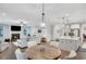 Spacious living room flows into kitchen, with a fireplace and large windows to let in natural light at 174 Vandiver Ct, Acworth, GA 30101