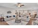 Open concept living room flows into the kitchen and dining room, boasting neutral paint and hardwood floors at 174 Vandiver Ct, Acworth, GA 30101