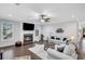 Comfortable living room featuring a cozy fireplace, large windows, neutral paint and plush furniture at 174 Vandiver Ct, Acworth, GA 30101