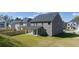 New construction home featuring a spacious backyard and covered patio, perfect for outdoor living at 1821 Lacebark Elm Way, Lawrenceville, GA 30045
