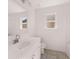 Bright bathroom with a large vanity, sleek fixtures, and tiled floors for a clean and modern look at 1821 Lacebark Elm Way, Lawrenceville, GA 30045