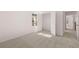 Bedroom featuring an open closet and window providing natural light, with neutral walls and carpet at 1821 Lacebark Elm Way, Lawrenceville, GA 30045
