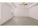Bright bedroom with neutral carpet, white walls, and ceiling fan with light fixture, offers a serene retreat at 1821 Lacebark Elm Way, Lawrenceville, GA 30045