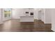 Beautiful kitchen with a center island, modern appliances, and seamless flow into the dining area at 1821 Lacebark Elm Way, Lawrenceville, GA 30045