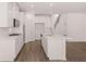 Well-equipped kitchen with modern appliances, a center island, and an open layout with stairs nearby at 1821 Lacebark Elm Way, Lawrenceville, GA 30045