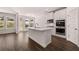 Modern kitchen features a center island, stainless steel appliances, and plenty of natural light at 1821 Lacebark Elm Way, Lawrenceville, GA 30045