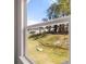 A bright view of surrounding houses through the window at 1821 Lacebark Elm Way, Lawrenceville, GA 30045