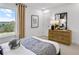 Bright bedroom with natural light, modern dresser, and outdoor view at 5365 Julep Ct, Cumming, GA 30028