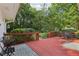 Large wooden deck features outdoor seating overlooking a lush, green backyard with mature trees at 5623 Crestwood Dr, Stone Mountain, GA 30087