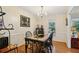 Elegant dining room with classic chandelier, stylish table setting, and detailed wall trim at 5623 Crestwood Dr, Stone Mountain, GA 30087