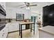 Functional kitchen featuring white cabinets, modern appliances, and an adjacent dining area at 5623 Crestwood Dr, Stone Mountain, GA 30087