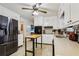 Efficient kitchen with white cabinets, tile flooring, and modern appliances for cooking convenience at 5623 Crestwood Dr, Stone Mountain, GA 30087