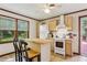 Bright, efficient kitchen with wooden cabinets and adjacent breakfast bar at 5623 Crestwood Dr, Stone Mountain, GA 30087
