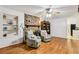 Cozy living room with hardwood floors, fireplace, and comfortable seating, creating a warm ambiance at 5623 Crestwood Dr, Stone Mountain, GA 30087