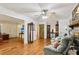 Spacious living room with hardwood floors, a fireplace, and ample space for relaxing and entertaining at 5623 Crestwood Dr, Stone Mountain, GA 30087