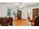 Office space featuring wood floors, natural light, and a doorway into an adjacent bathroom at 5623 Crestwood Dr, Stone Mountain, GA 30087