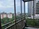 Balcony view of downtown featuring views of buildings and trees at 300 Peachtree St # Apt 9D, Atlanta, GA 30308