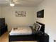 Cozy bedroom with hardwood floors, platform bed, and minimalist decor at 300 Peachtree St # Apt 9D, Atlanta, GA 30308