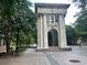 City park featuring stone archway, brick pathways, and green trees at 300 Peachtree St # Apt 9D, Atlanta, GA 30308