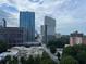 City view featuring blue skies and multiple high rise buildings in the city at 300 Peachtree St # Apt 9D, Atlanta, GA 30308