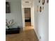 Hallway with hardwood floors leading to bedroom, featuring stylish decor at 300 Peachtree St # Apt 9D, Atlanta, GA 30308