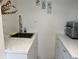 Kitchen area with stainless steel sink, and white marble countertops at 300 Peachtree St # Apt 9D, Atlanta, GA 30308