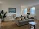 Comfortable living room with hardwood floors, sofa with throw pillows, and a desk at 300 Peachtree St # Apt 9D, Atlanta, GA 30308