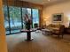 Relaxing lobby area with comfortable seating, a large window overlooking greenery, and tasteful decor at 300 Peachtree St # Apt 9D, Atlanta, GA 30308