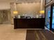 Reception desk in a well-lit lobby with stone accent wall and a branded welcome mat at 300 Peachtree St # Apt 9D, Atlanta, GA 30308