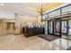 Grand lobby features a concierge desk, chandelier, tile floors, and glass doors to the exterior at 300 Peachtree St # Apt 9D, Atlanta, GA 30308