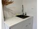 Close up of a sink with white marble countertops and stainless steel faucet at 300 Peachtree St # Apt 9D, Atlanta, GA 30308