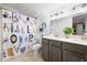 Charming bathroom features vanity, shower curtain and tiled floors at 4554 Grenadine Cir, Acworth, GA 30101