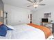 Comfortable bedroom featuring a bed, ceiling fan, closet, and plenty of natural light at 4554 Grenadine Cir, Acworth, GA 30101