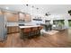 Modern kitchen with stainless steel appliances, a center island with bar stools, and hardwood floors at 4554 Grenadine Cir, Acworth, GA 30101