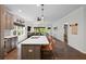 Open concept kitchen with island, pendant lighting, stainless steel appliances, and hardwood floors at 4554 Grenadine Cir, Acworth, GA 30101