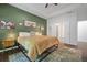 Main bedroom with tray ceiling, green accent wall and ensuite bathroom access at 4554 Grenadine Cir, Acworth, GA 30101