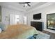 Main bedroom with tray ceiling, dark wood dresser, and large ensuite bathroom at 4554 Grenadine Cir, Acworth, GA 30101
