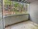 Private outdoor balcony overlooking a lush, wooded area and other residences at 501 Vicksburg Pl, Atlanta, GA 30350