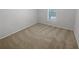 Neutral bedroom with neutral carpet and one window; a blank canvas to make your own at 501 Vicksburg Pl, Atlanta, GA 30350