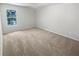 A vacant bedroom with neutral carpeting and a large window at 501 Vicksburg Pl, Atlanta, GA 30350