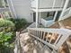 Condo entrance with stairs, white railings, and a wooded setting at 501 Vicksburg Pl, Atlanta, GA 30350