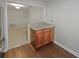 Kitchen pass-through with granite counters offers a peek into a carpeted dining or living space at 501 Vicksburg Pl, Atlanta, GA 30350