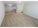 Spacious and light-filled living room with neutral carpeting and paint at 501 Vicksburg Pl, Atlanta, GA 30350