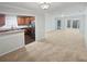 Open concept living space with updated kitchen and views into a bright carpeted sitting room at 501 Vicksburg Pl, Atlanta, GA 30350