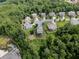 Aerial view of the neighborhood with mature trees, showcasing the property's location within a desirable community at 521 Andes Ln, Canton, GA 30114