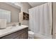 Cozy bathroom boasts a white vanity top, a shower with a curtain, and a rustic wooden shelf at 521 Andes Ln, Canton, GA 30114