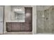 Elegant bathroom offers a spacious glass shower, large vanity with modern finishes, and ample lighting at 521 Andes Ln, Canton, GA 30114
