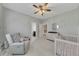 Bright Bedroom featuring a crib, changing table, and cozy chair provides a warm and welcoming environment at 521 Andes Ln, Canton, GA 30114