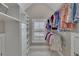 Walk-in closet with custom shelving and ample hanging space provides organized storage solutions at 521 Andes Ln, Canton, GA 30114